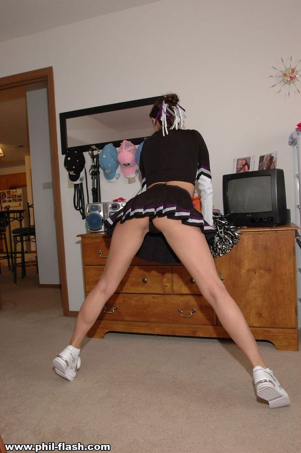 Cheerleader flashing a thong