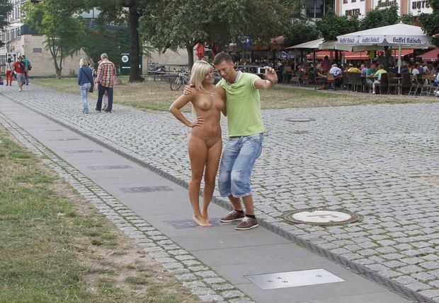 Taking selfie with nude woman