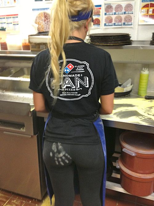 Flour handprint on her black yoga pants ass