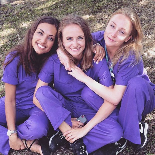 group of girls in purple scrubs