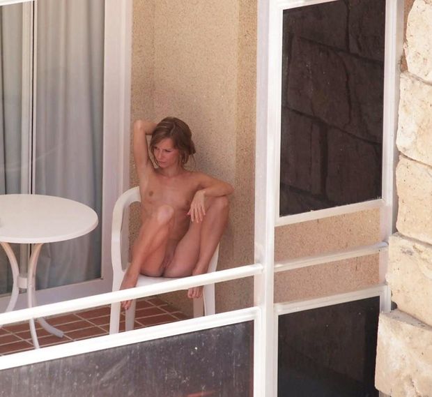 Naked on the balcony