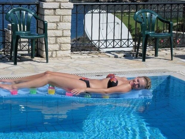 laying on a float in the pool