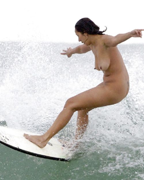 She's surfing naked.