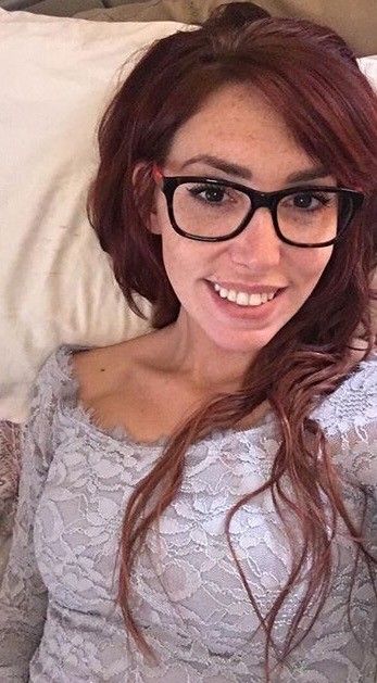 Glasses Freckles red hair and a nice smile