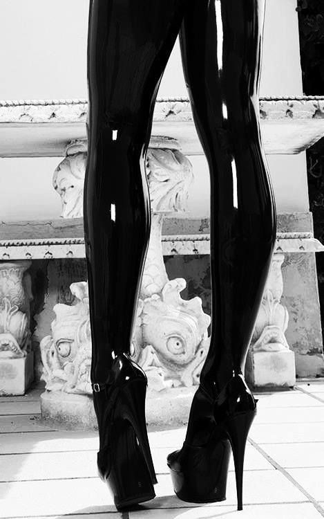 Black latex leggings and platform heels