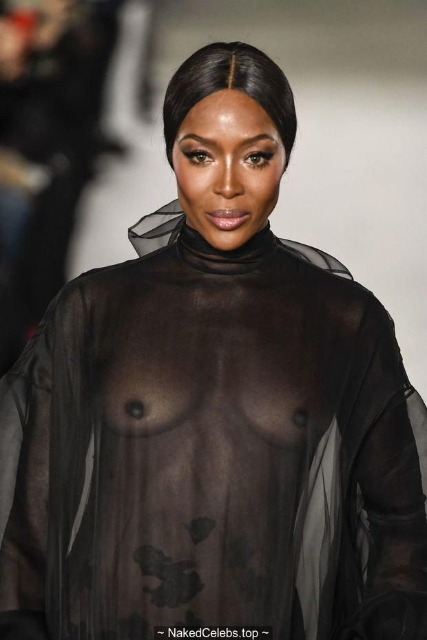 Naomi Campbell topless in see through dress