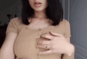 Ripping shirt revealing boobs.