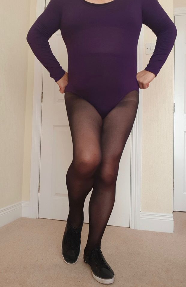 In leotard and tights