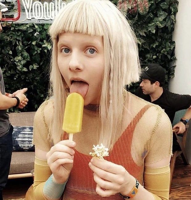 Aurora Asknes licking her popsicle like an amateur licking the tip of a penis