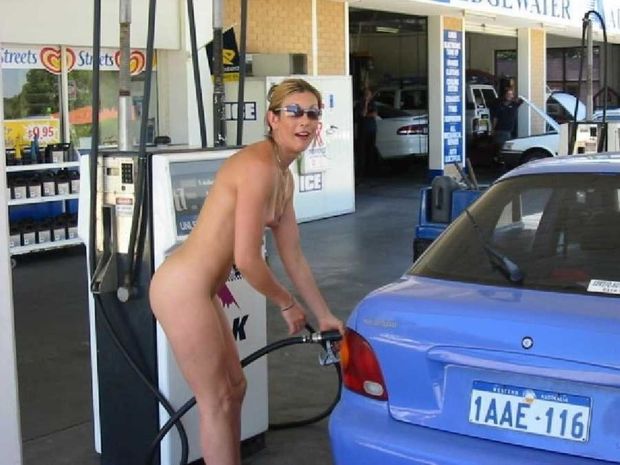 Naked woman filling gas