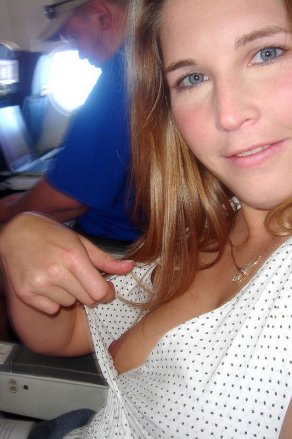 Cutie flashing her tit in her airplane seat-see more daring amateurs on our blog