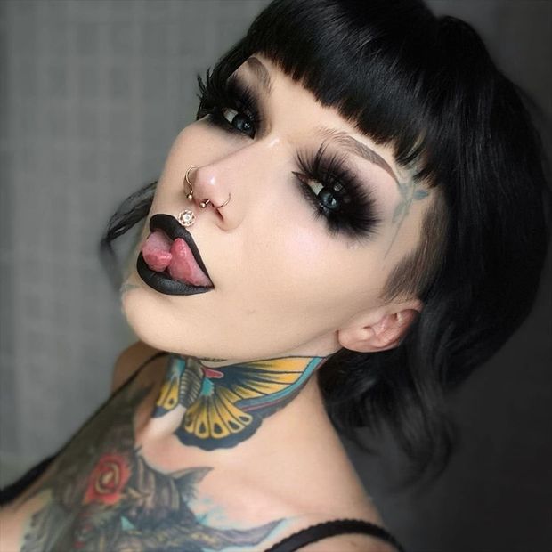 Goth woman with a split tongue