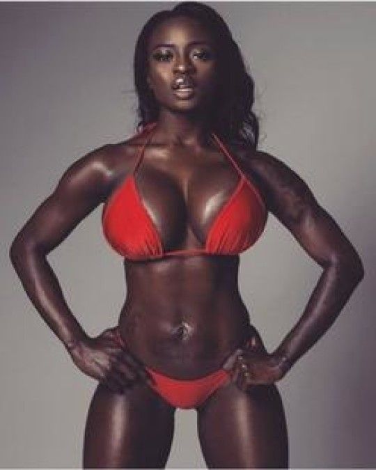 Dark skin beauty with abs in red bikini