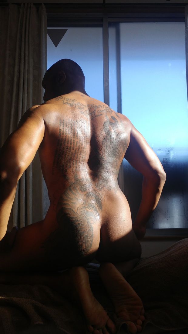 Black man with AMAZING back tattoo.