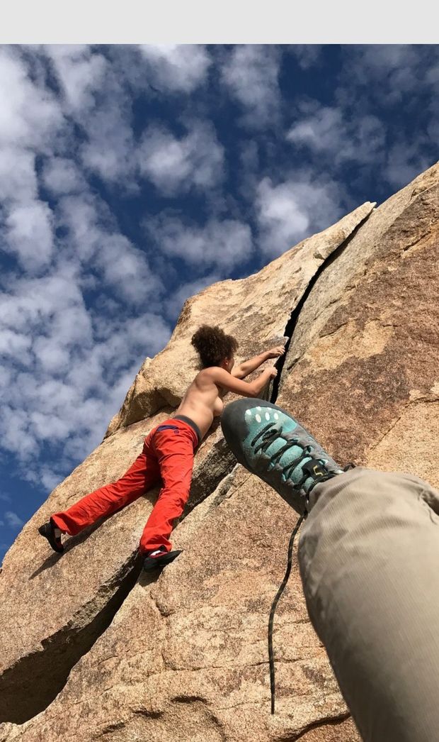 Topless climber from below