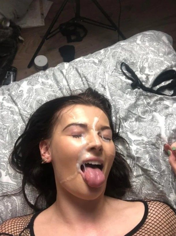 Brunette whos face is plastered in cum