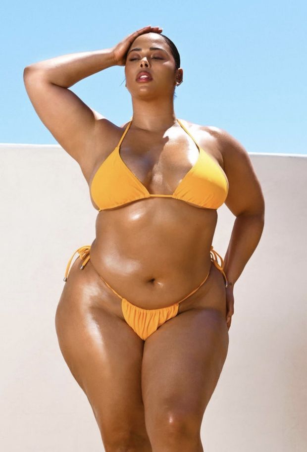 Tabria Majors looking beautiful as she poses in her Orange bikini