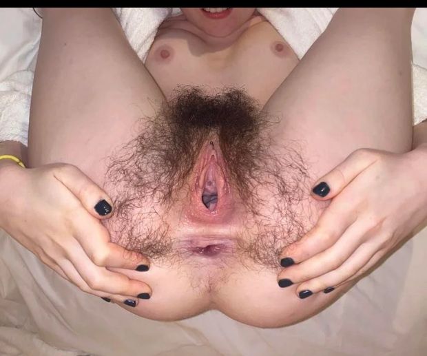 Spreading her hairy holes