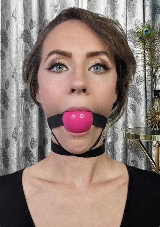 Captive silenced with a pink ball gag