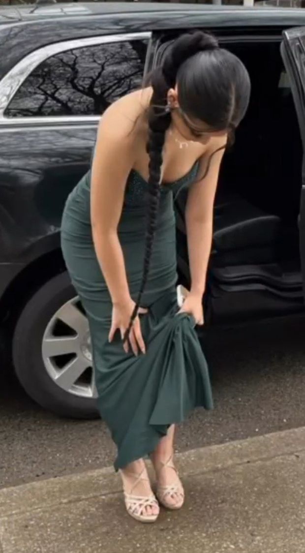 Sam in prom dress bent over