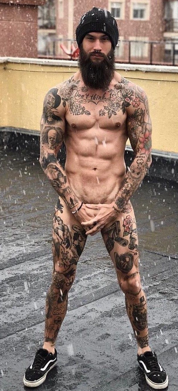 Male nude tattoed under snow