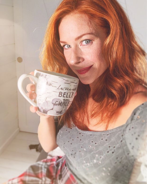 Sexy redhead drinking coffee