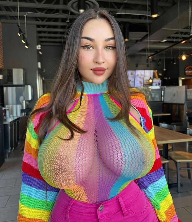 Louisa rainbow see-through top in restaurant