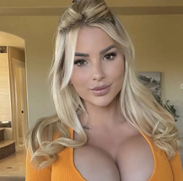 Blonde in orange sweater huge tits