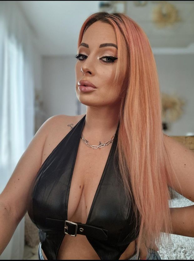 Guilia piana pink hair and with deep cleavage