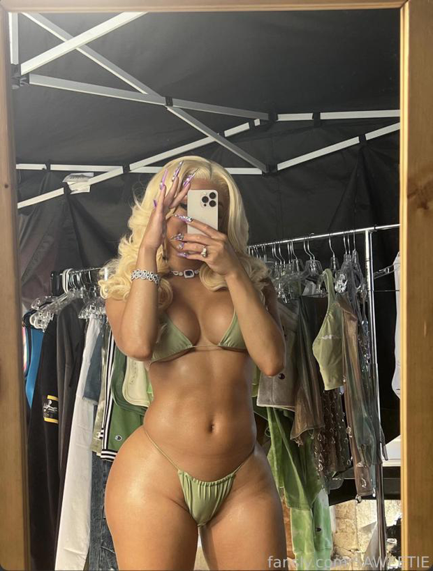 Saweetie in a Green bikini